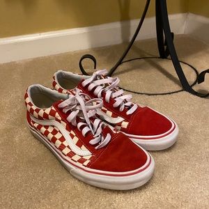 Red and white checked low top vans.